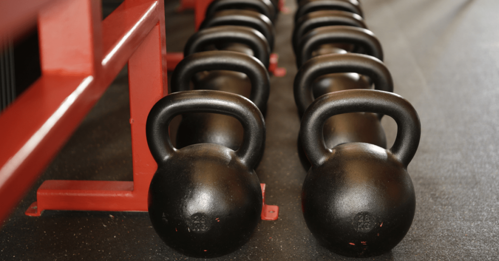 two lines of black kettlebells