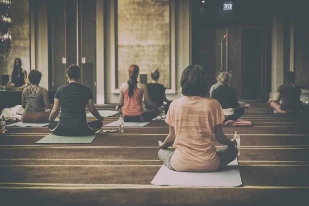 a yoga class from behind