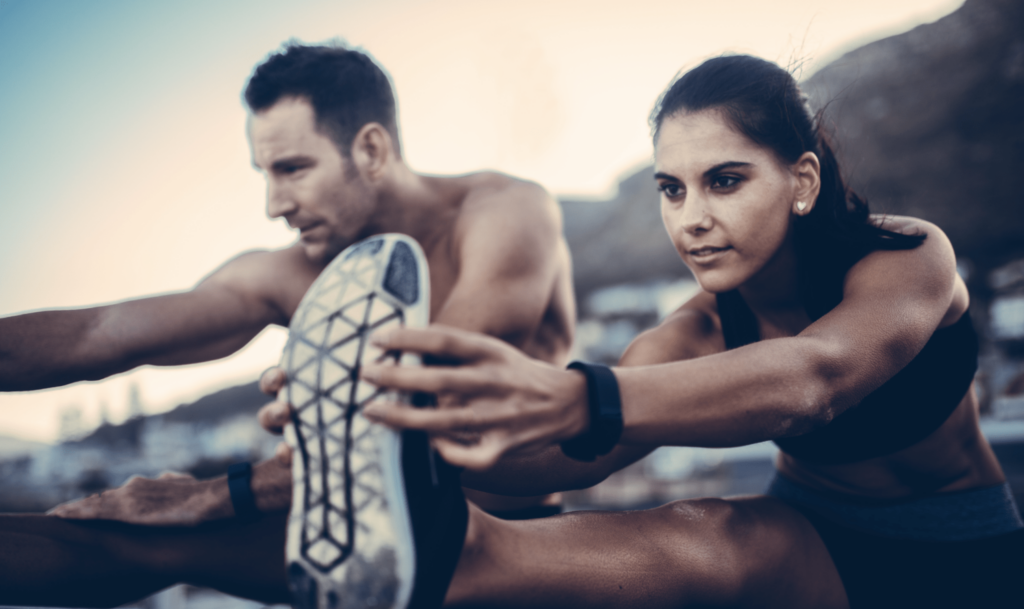 two people stretching