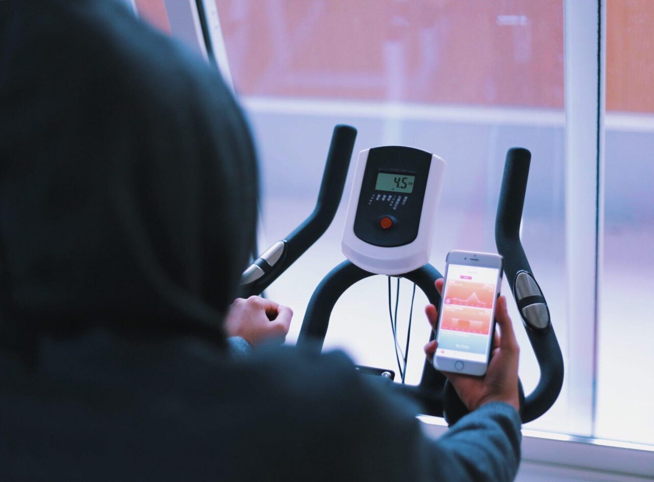 a person on a bike with a phone a person on a bike with a phone