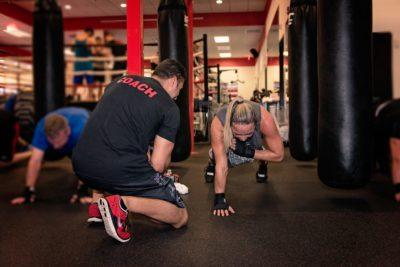 a coach motivating gym members