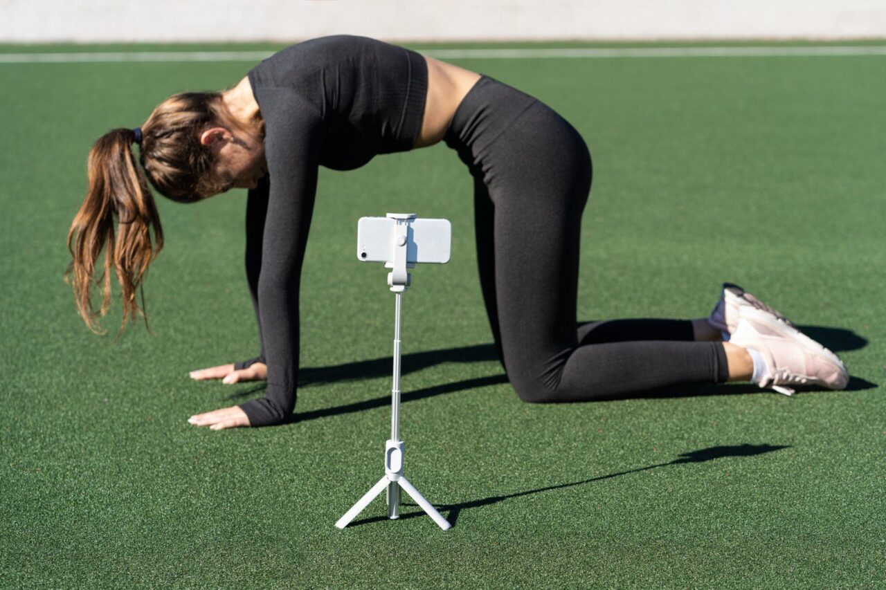 woman doing yoga pose in front of camera