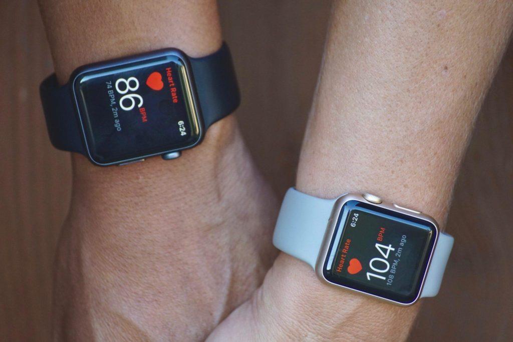 fitness trackers on wrists