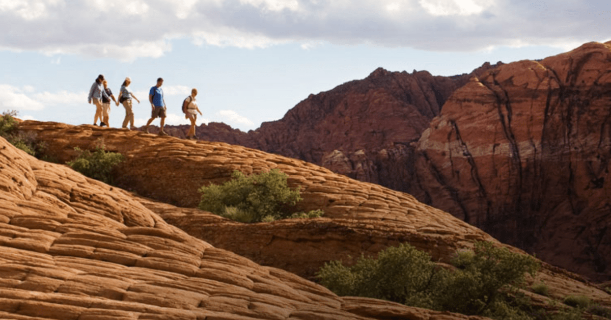 People walking on a red mountain top
