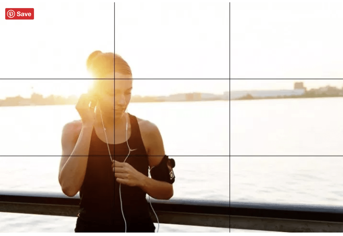 Woman standing at a bridge with a rule of thirds frame over her