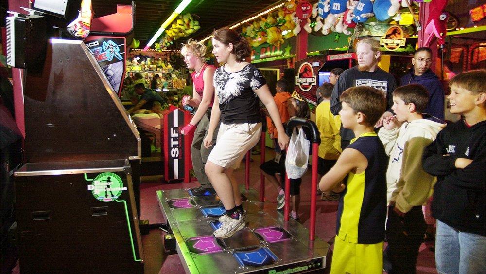 group playing dance dance revolution