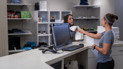 Woman makes sell of towel for gym business