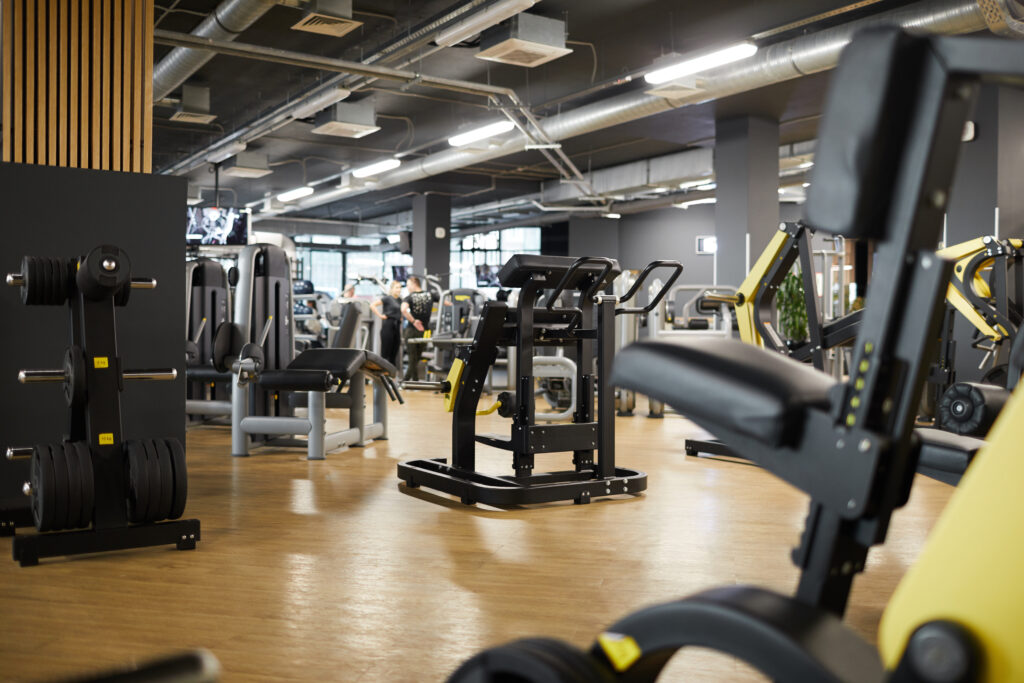 Background,Image,Of,Various,Exercise,Machines,In,Workout,Hall,Of